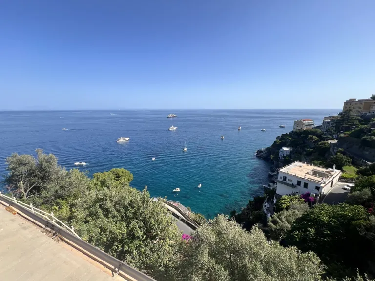 Elegant interior of Villa Mansi luxury suite with Mediterranean design and sea view windows